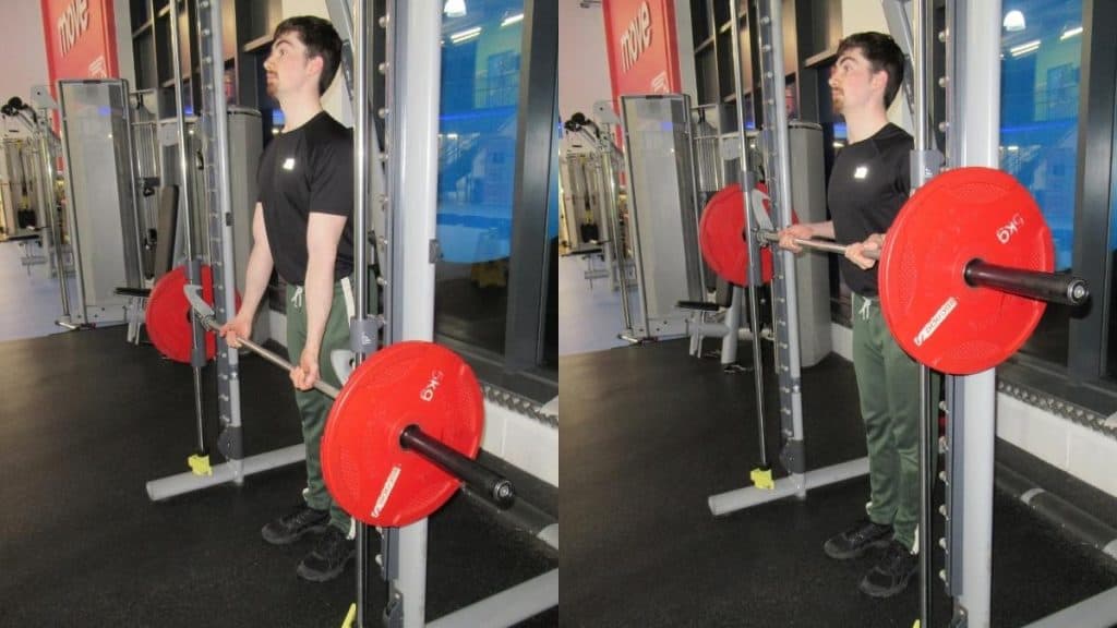 A man making a common Smith machine drag curls mistake: standing too far away from the bar