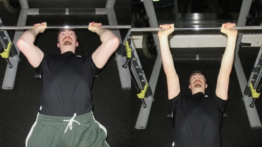 A man doing Smith machine skull crushers