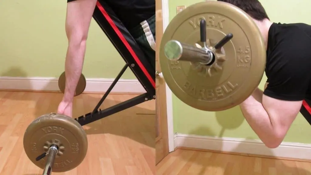 A man doing a spider barbell curl