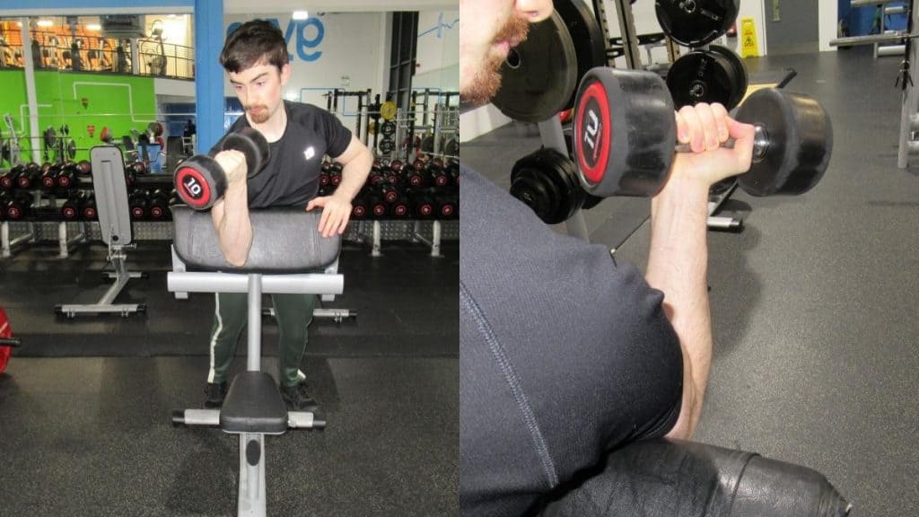 A man performing spider bench curls with a dumbbell
