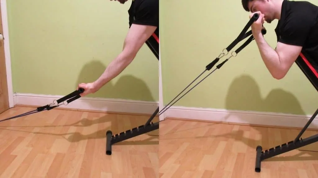 A man doing a spider curl with a resistance band