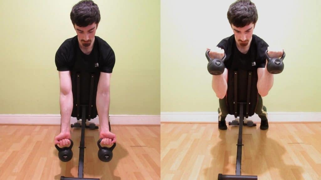 A man doing spider kettlebell curls