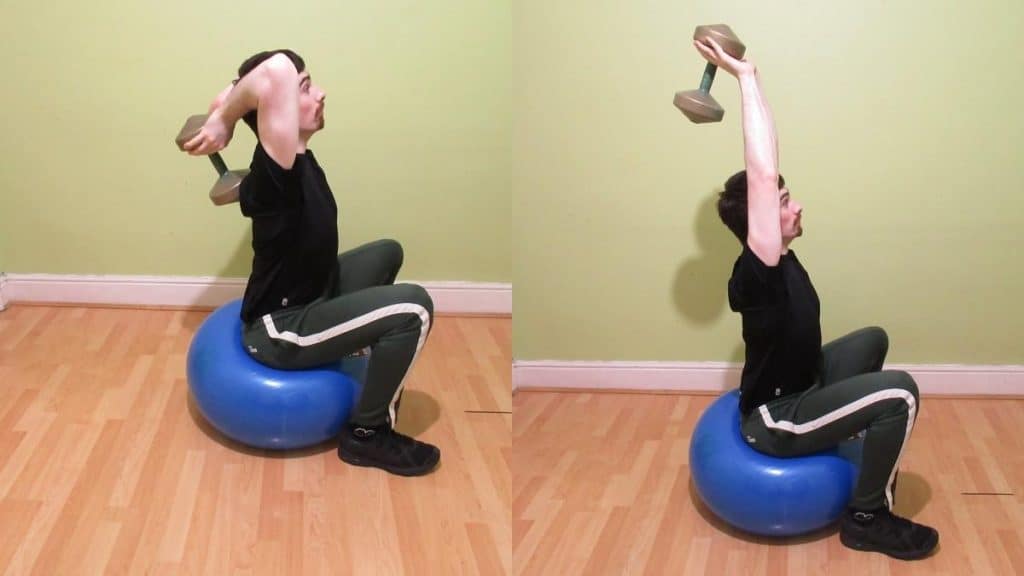 A man doing a stability ball overhead tricep extension