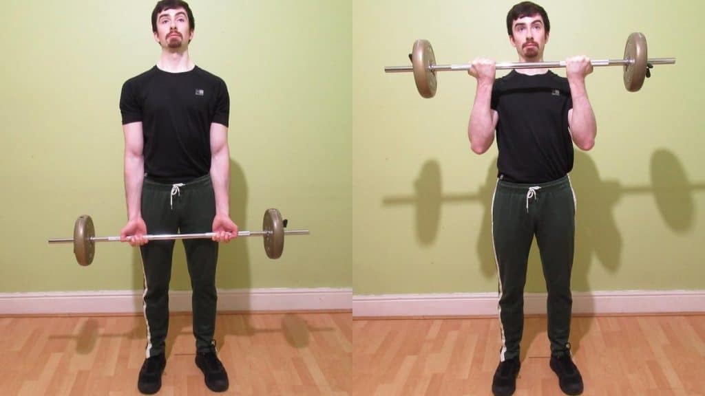 A man doing a standing barbell curl to work his biceps