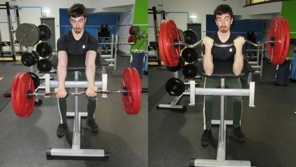 A man doing a standing bicep preacher curl