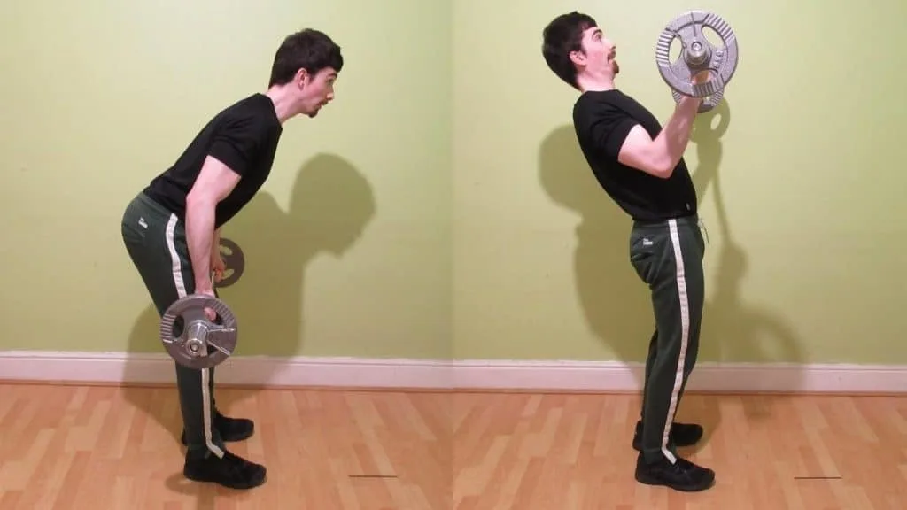 A man performing standing EZ curls