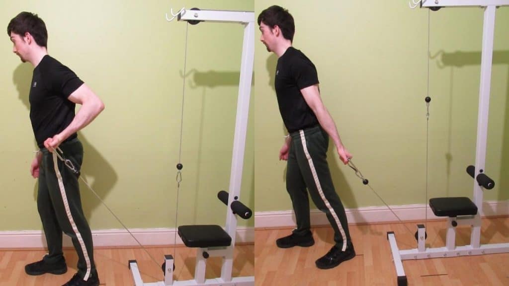 A man doing a standing one arm behind the back cable curl