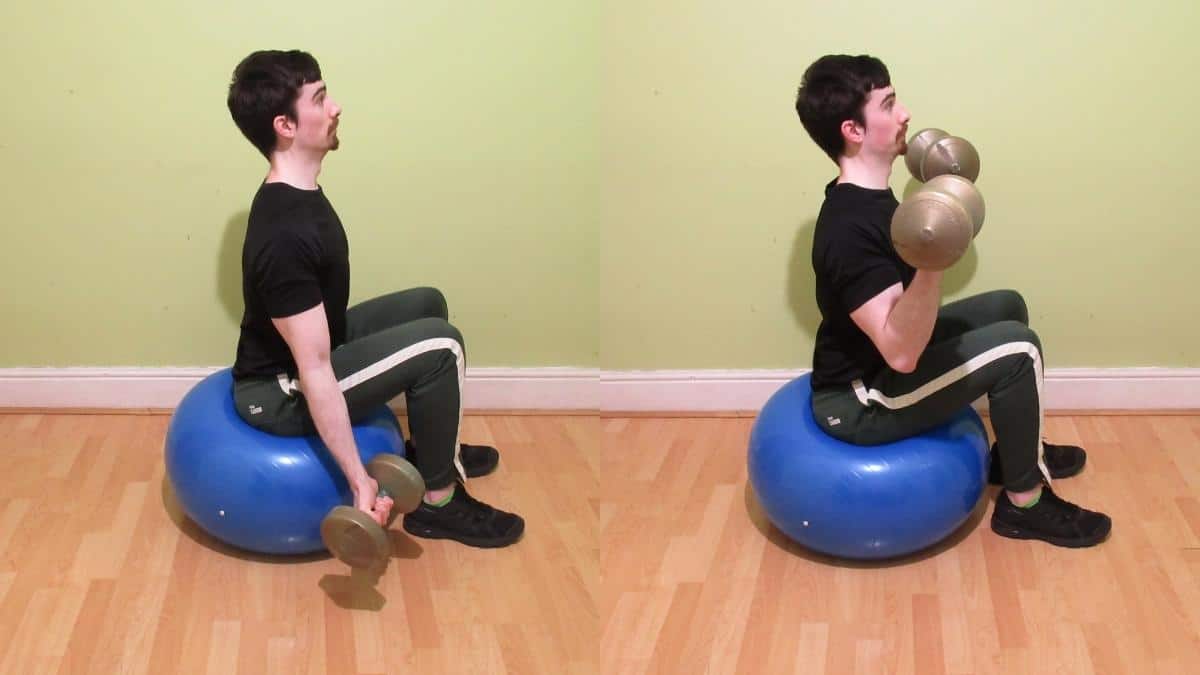 A man performing Swiss ball bicep curls with some dumbbells