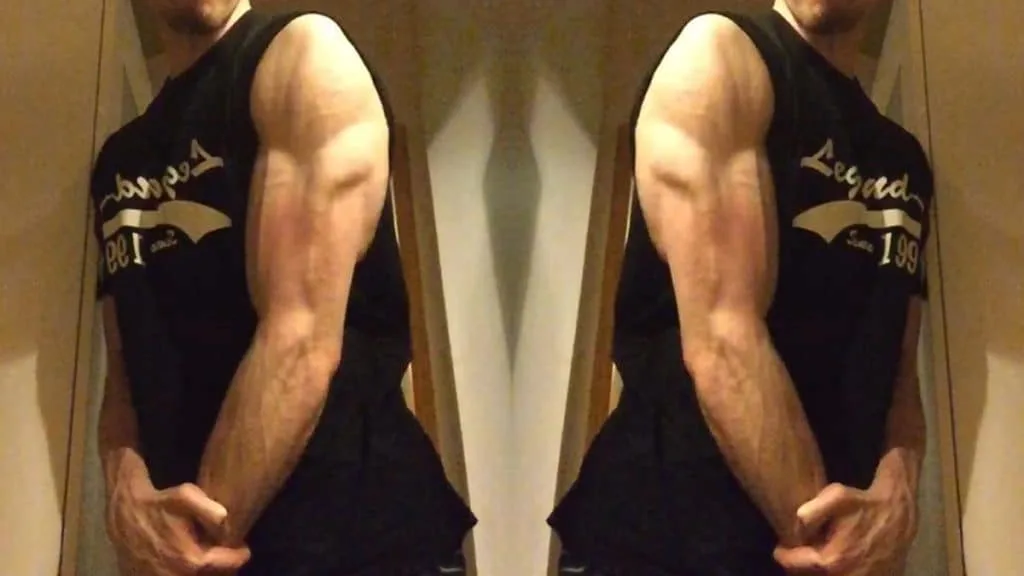 A muscular man showing his symmetrical triceps