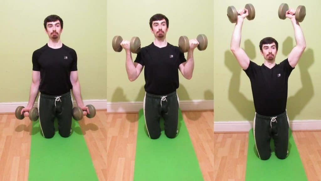 A man doing a tall kneeling curl to press for his biceps