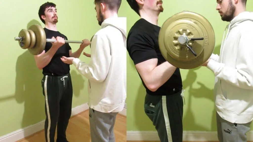 Two men doing training partner bicep curls