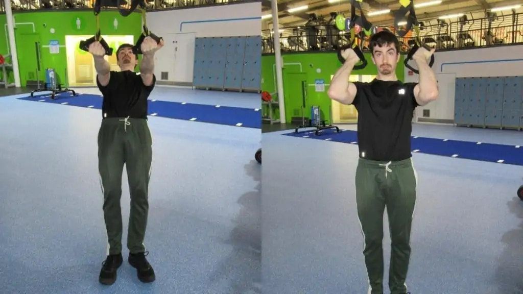 A man performing a TRX bicep workout with his suspension trainer