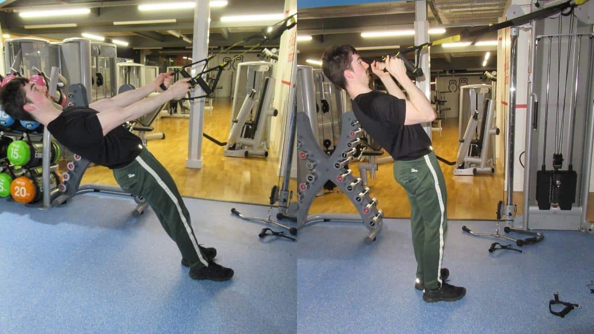 A man performing TRX hammer curls at the gym