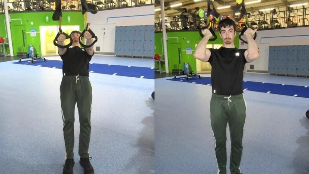 A man performing Zottman curls on a TRX suspension trainer