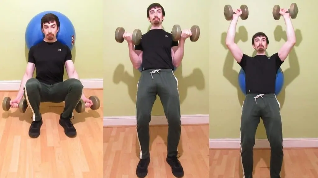 A man doing a two arm ball squat curl to press