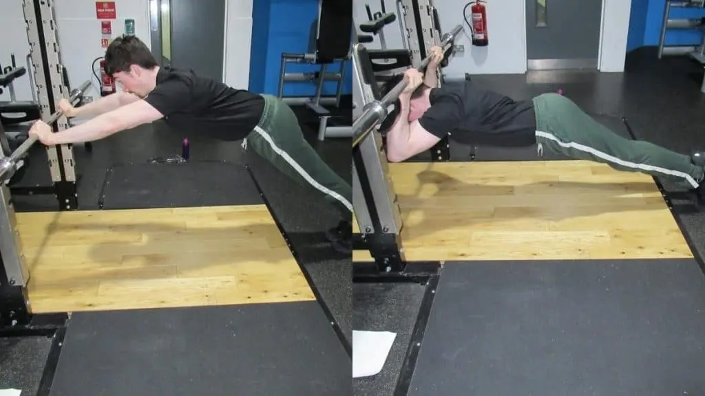 A man doing an underbar tricep extension with his bodyweight