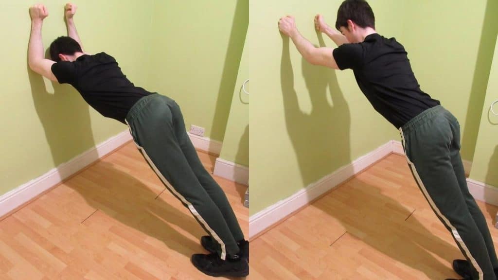 A man doing wall triceps extensions