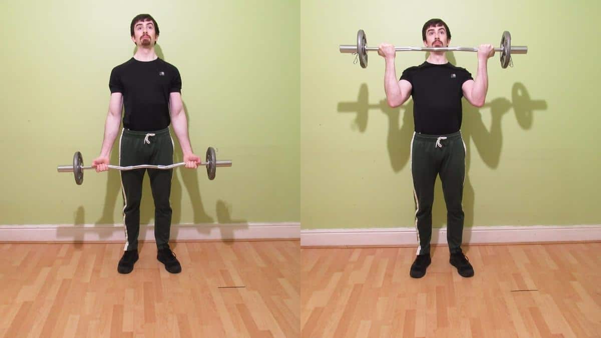 A man doing a wide EZ bar curl with a firm grip to work his biceps