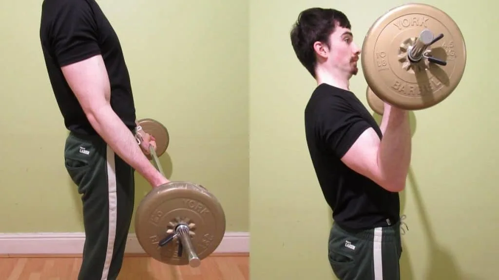 A man performing wide grip barbell curls for his biceps