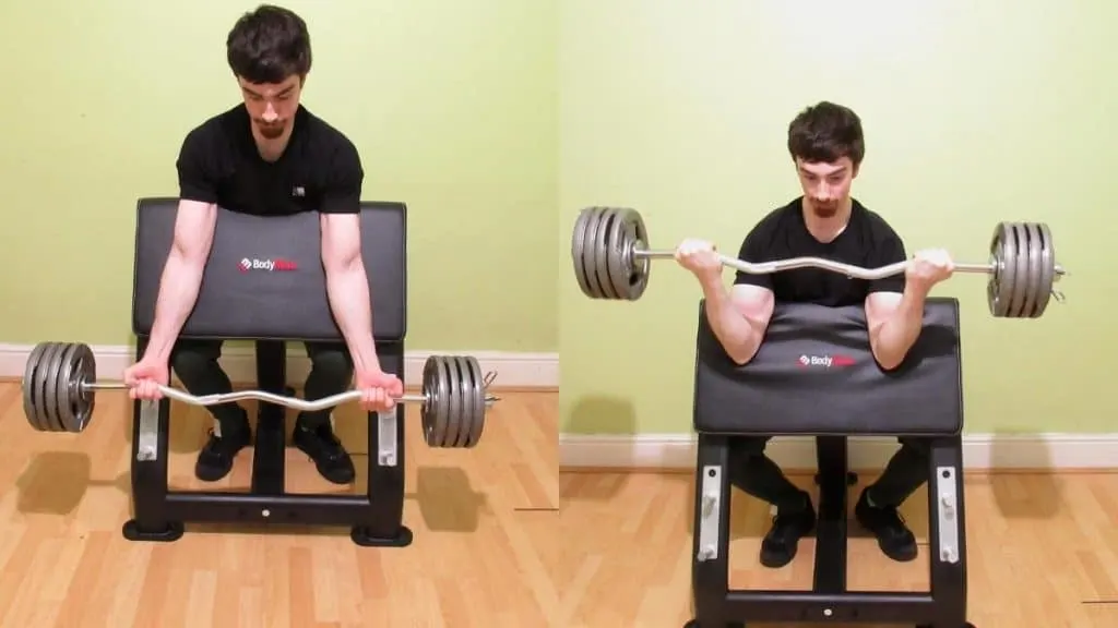 A man doing wide grip EZ bar preacher curls for his biceps