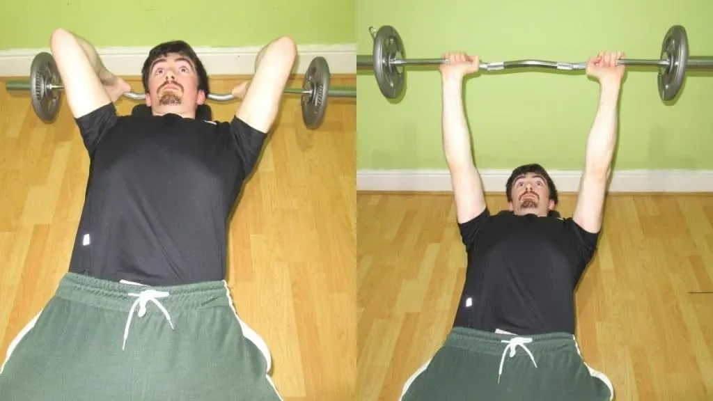 A man doing a wide grip skull crusher to work his triceps