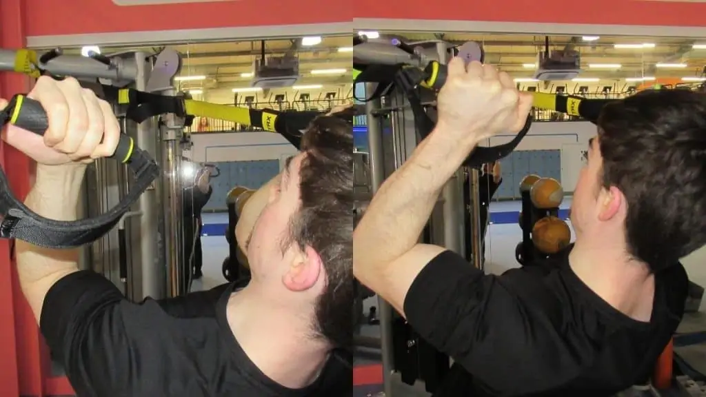 A man doing a Zottman curl on a TRX