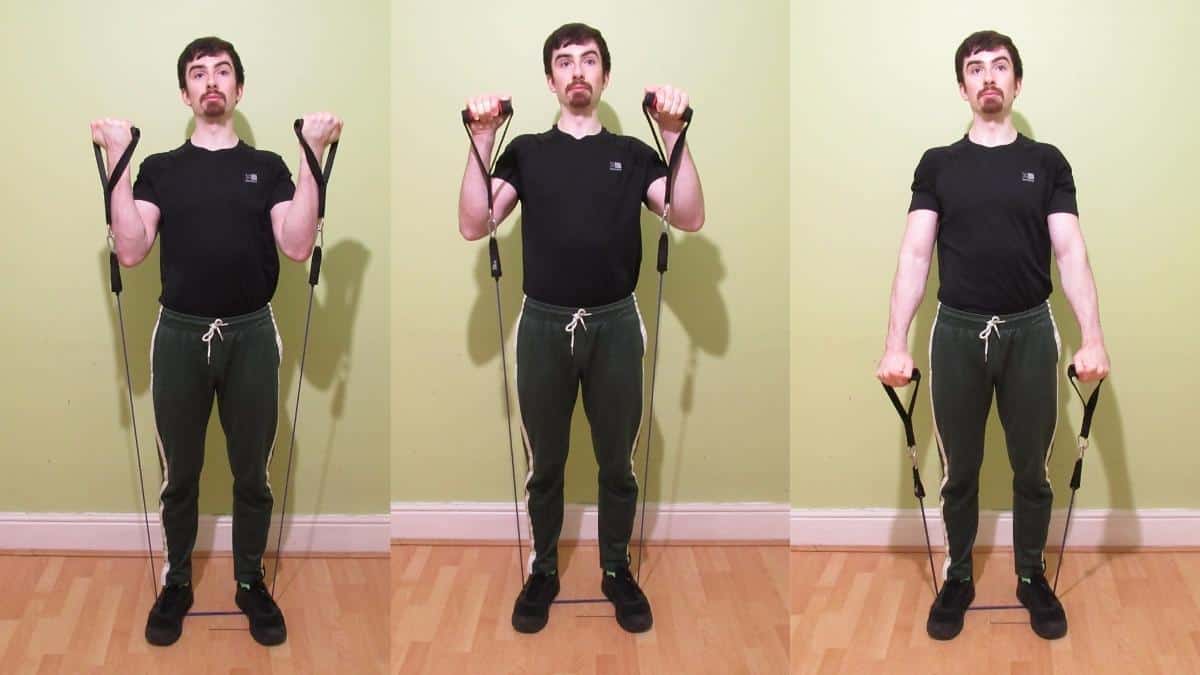 A man performing Zottman curls with resistance bands