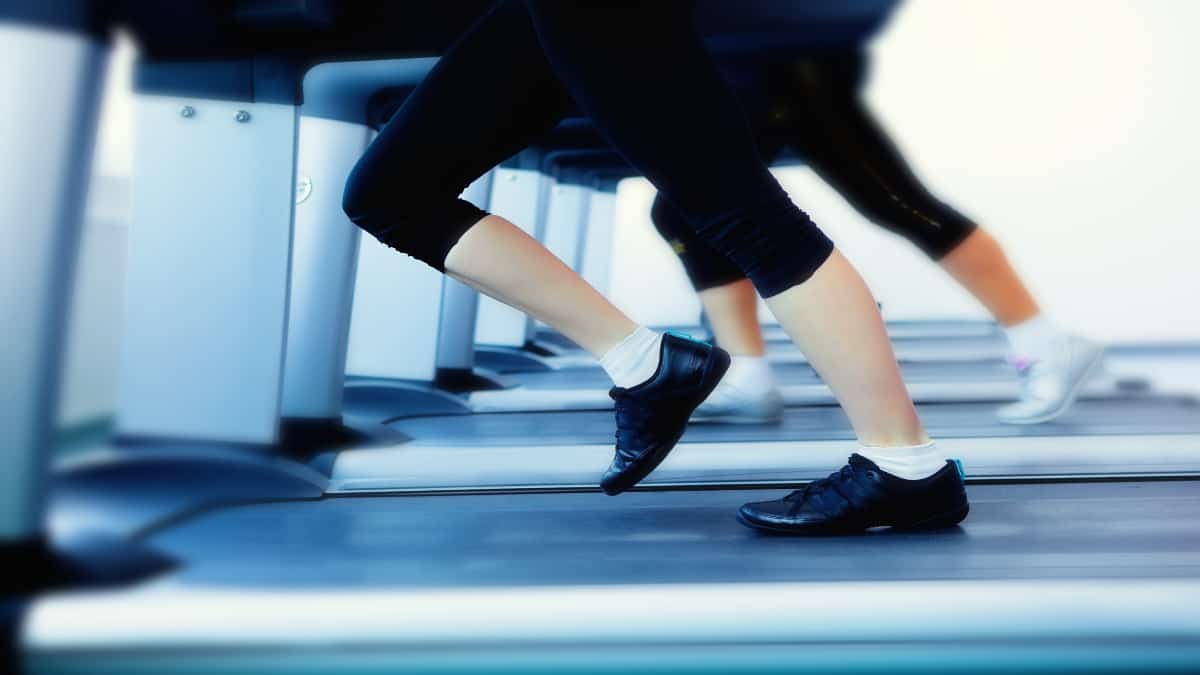 A lady with 12 inch calves running on the treadmill
