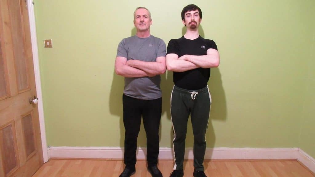 Two men folding their arms and displaying their 12 inch forearms