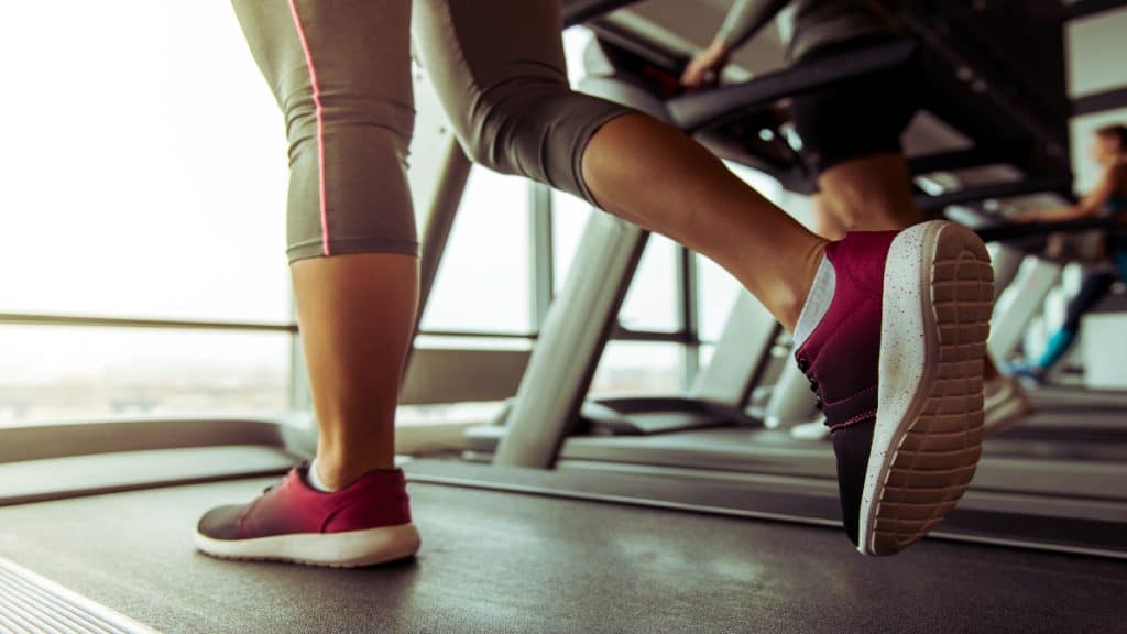 A woman with 12.5 inch calves jogging on the treadmill