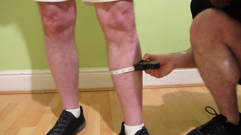 A man getting his 15 inch calf circumference measured