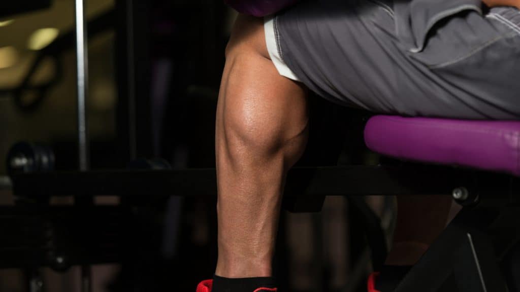 A man at the gym showing his 16.5 inch calves