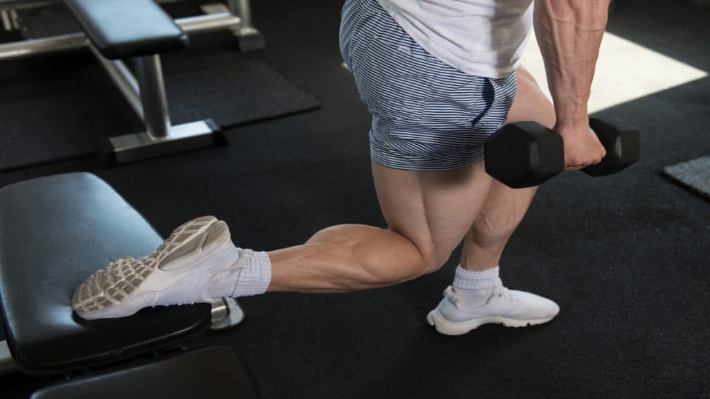 A man working his 19 inch calf muscles at the gym