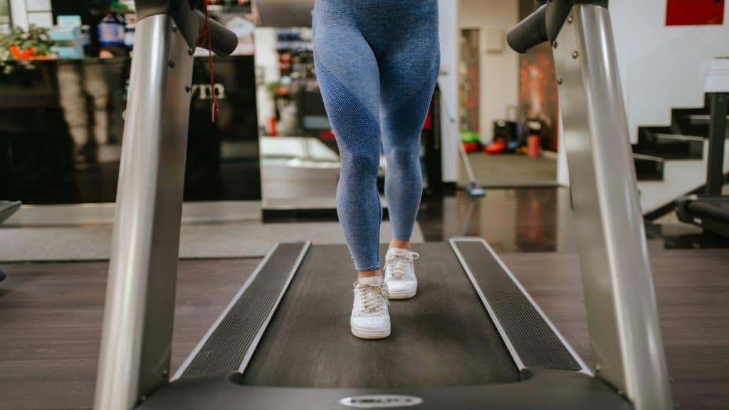 A woman with 23 inch thighs walking on the treadmill