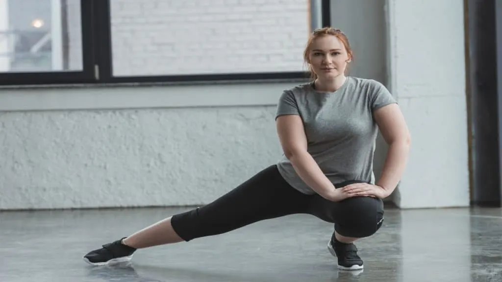 A female stretching her 24 inch legs