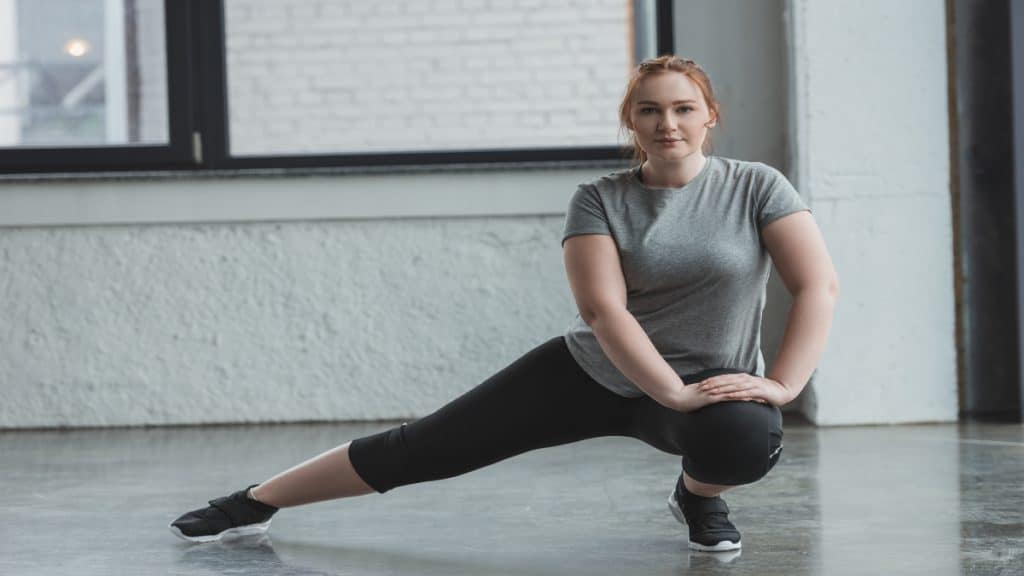 A woman stretching her 25 inch legs