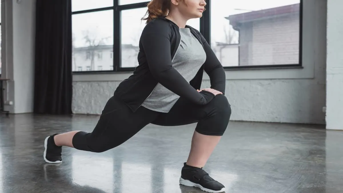 A woman stretching her 25 inch thighs