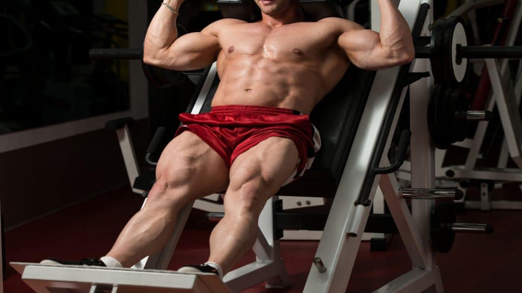 A bodybuilder training his 30 inch quads at the gym