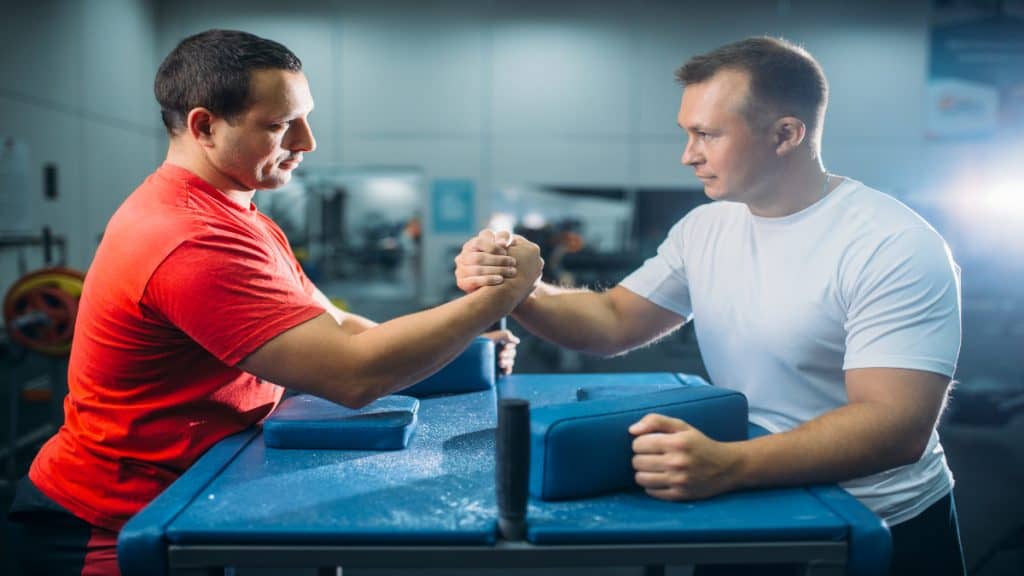 Two men having an arm wrestling match