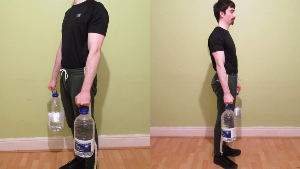 A muscular man performing an at home forearm workout without any weights
