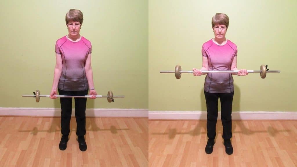 A woman lifting the average barbell curl weight for a female