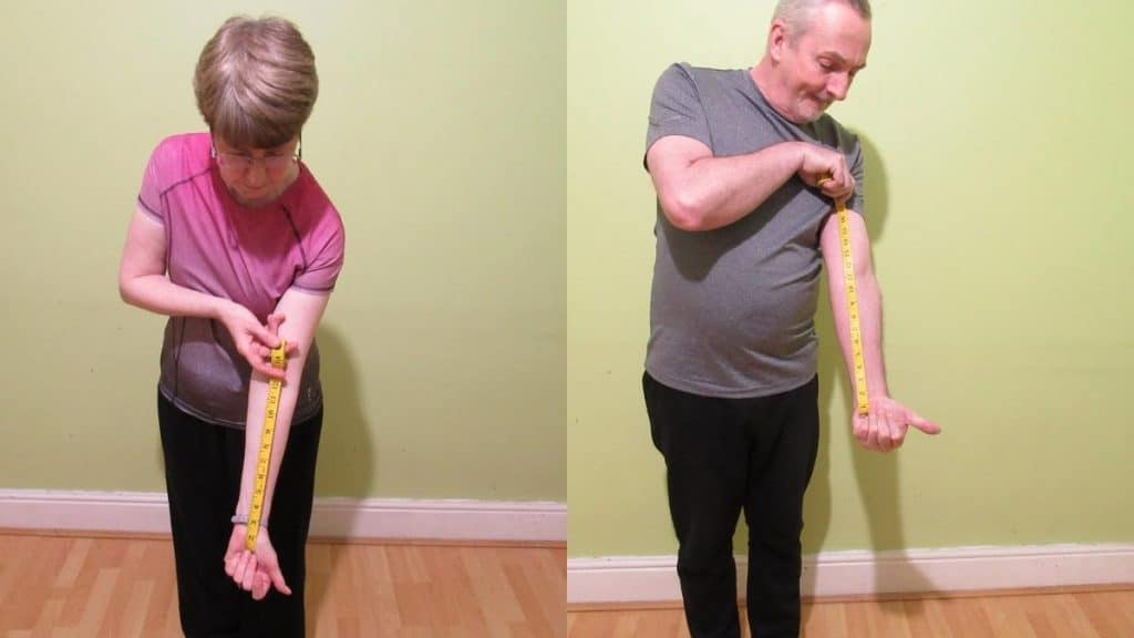 A man and a woman measuring their forearm length to see if it's above average