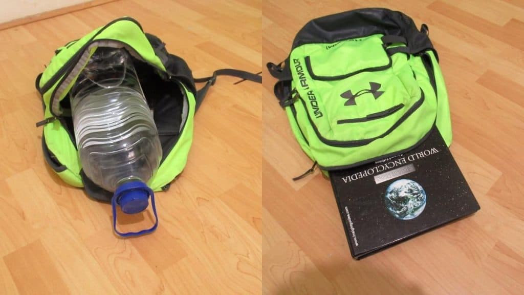A backpack containing a water bottle and a heavy book