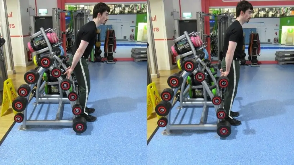 A weight lifter doing a behind the back forearm curl at the gym