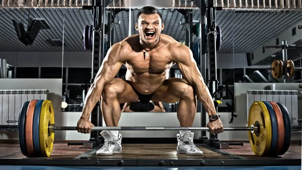 An intense bodybuilder doing a deadlift