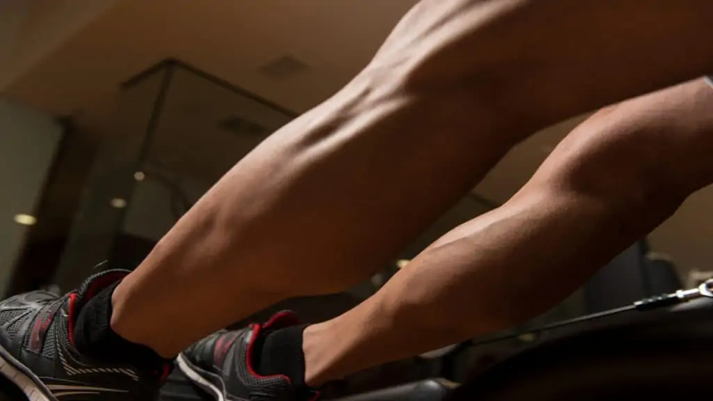 A man at the gym showing his calf girth