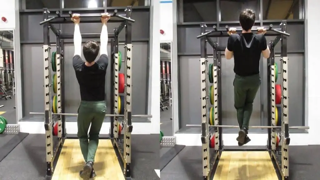 A man performing chin ups at the gym