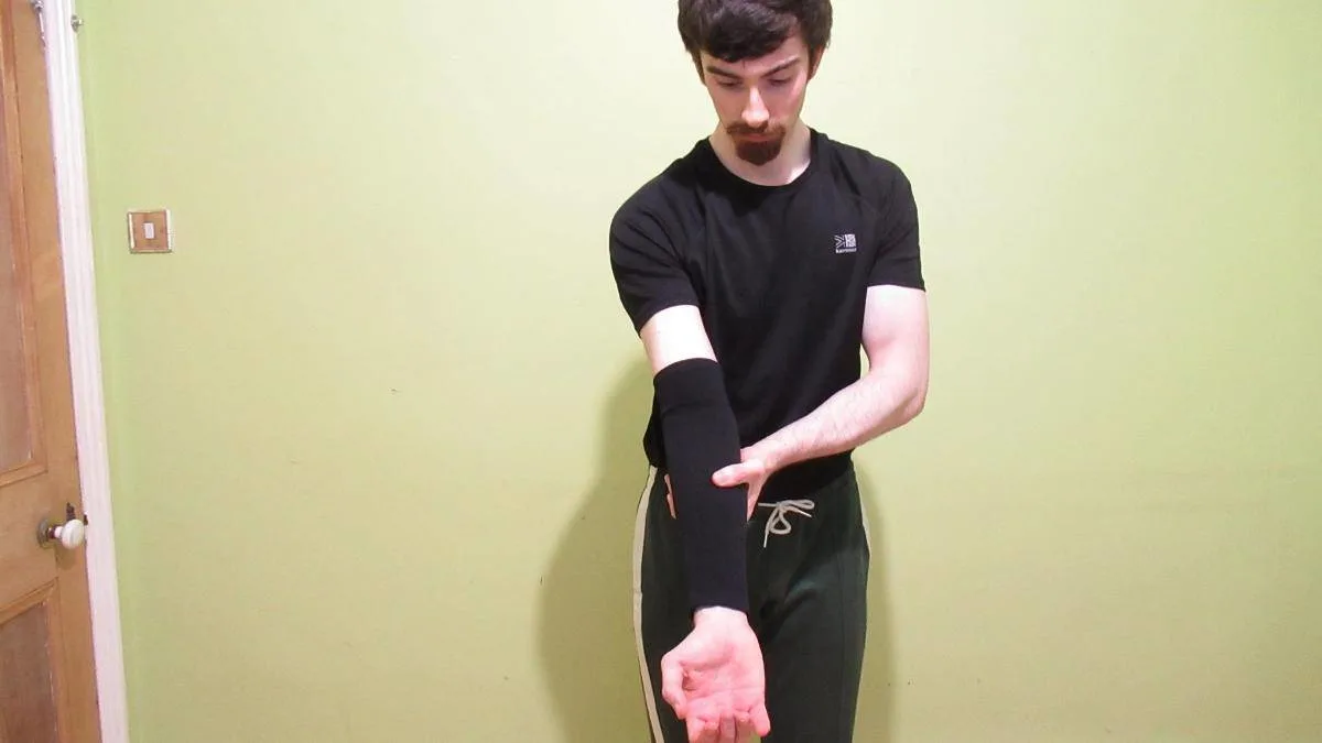 A man wearing his compression forearm sleeve