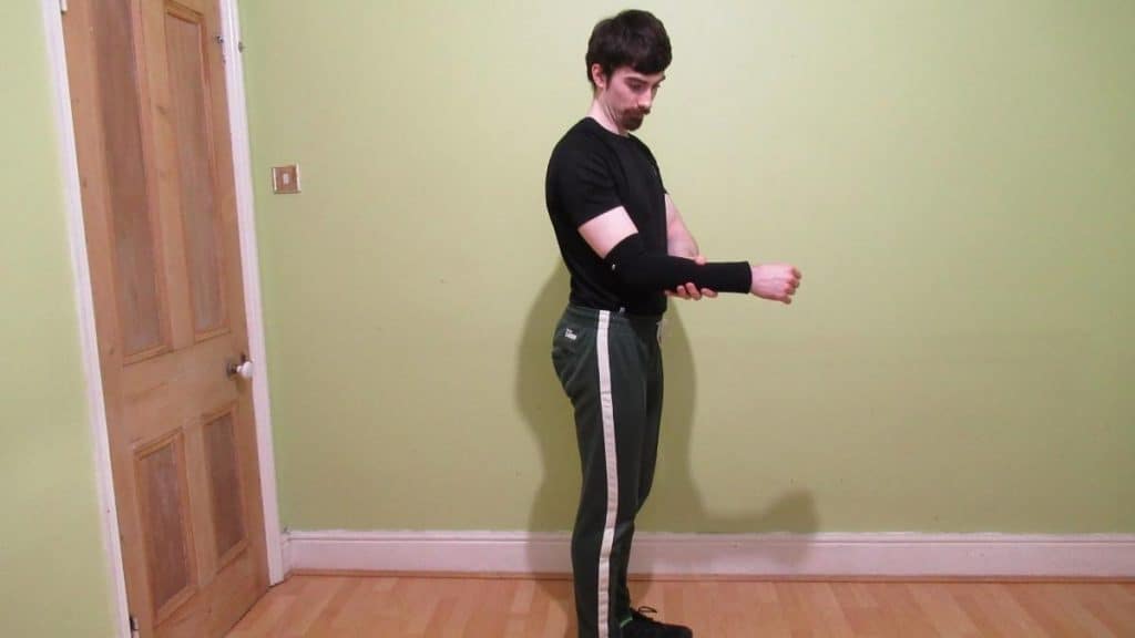 A man wearing a compression sleeve because he has forearm pain