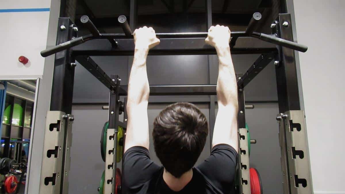 A man demonstrating how pull ups work your forearms